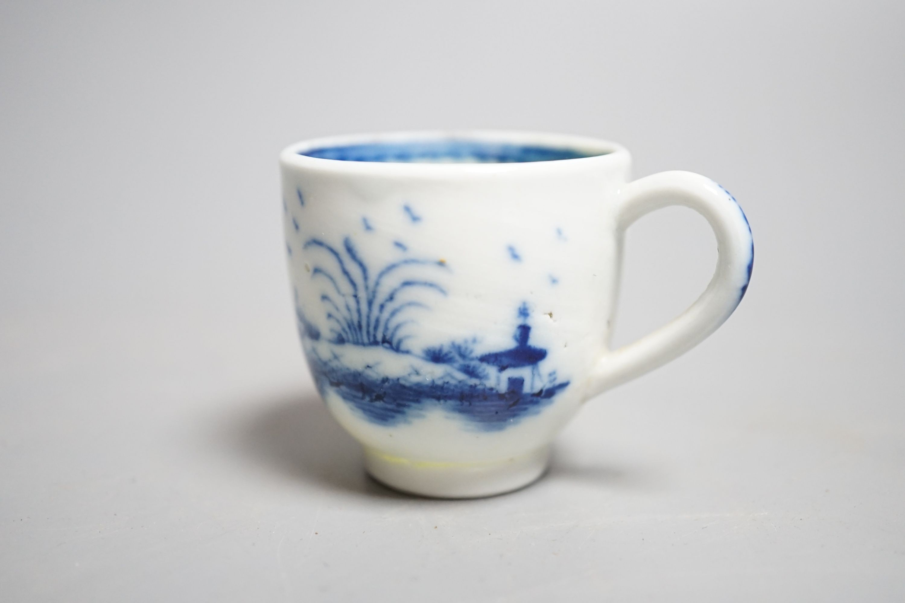 A Caughley 'The Island pattern' blue and white miniature cup, c.1780, 3.4cm. Provenance - Mona Sattin collection of miniature cups and saucers, collection no.16.